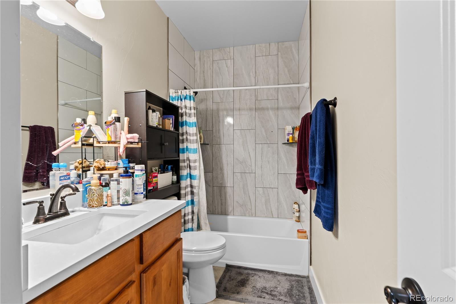 109 7th Avenue Wiggins, CO 80654 - Photo 27 of 38 a bathroom with a sink toilet and shower