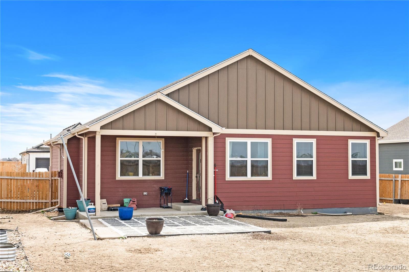 109 7th Avenue Wiggins, CO 80654 - Photo 33 of 38 a view of a house with yard and sitting area