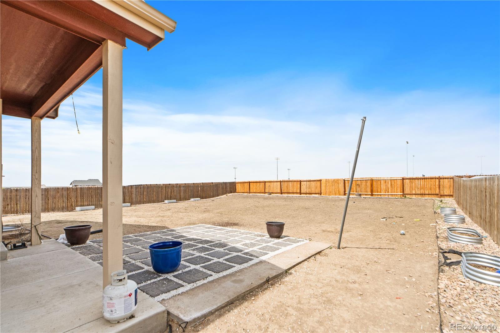 109 7th Avenue Wiggins, CO 80654 - Photo 34 of 38 a view of an outdoor space with swimming pool