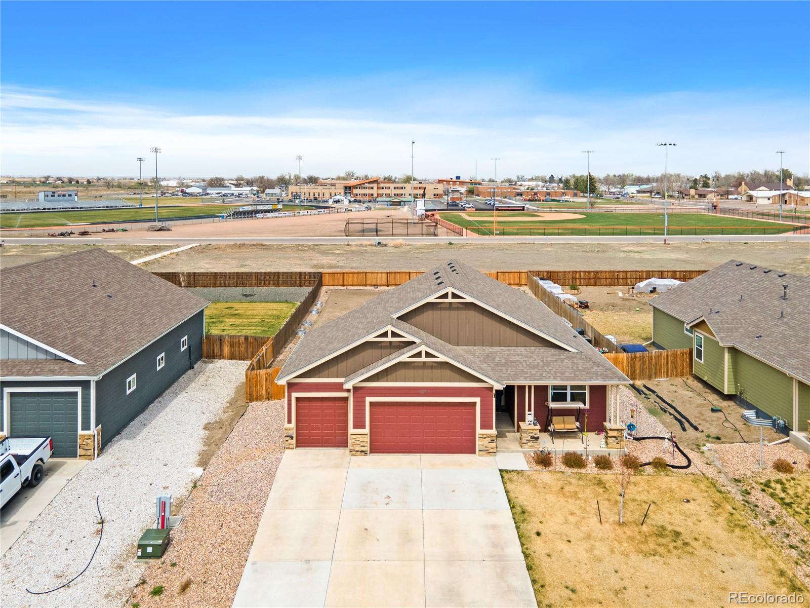 109 7th Avenue Wiggins, CO 80654 - Photo 36 of 38 a view of a city with an ocean