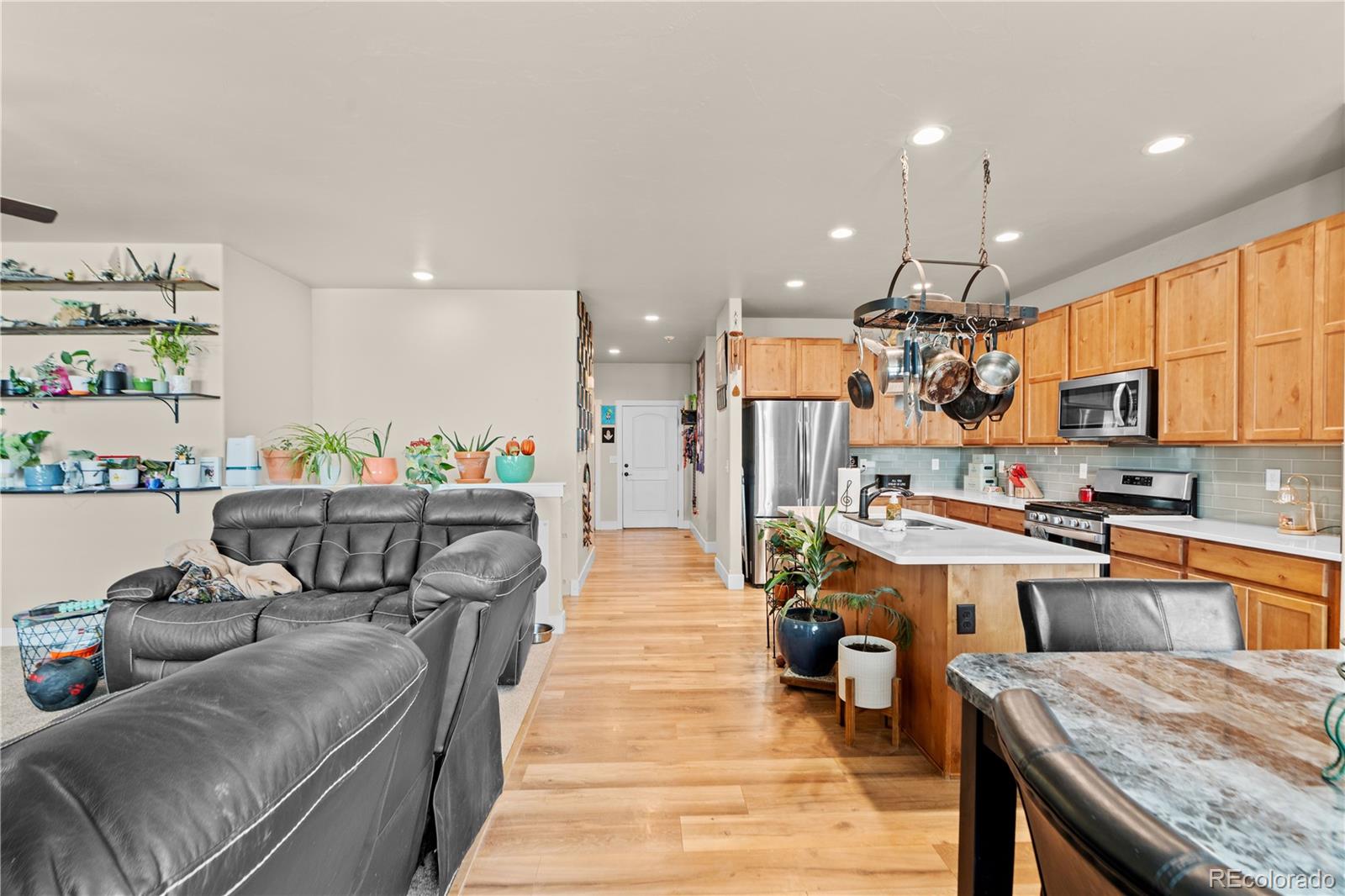 109 7th Avenue Wiggins, CO 80654 - Photo 5 of 38 a kitchen view of counter top space a sink appliances and cabinets