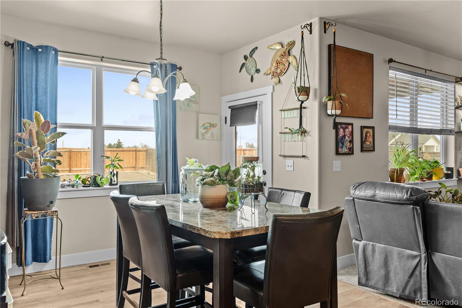 109 7th Avenue Wiggins, CO 80654 - Photo 7 of 38 a view of a dining room with furniture window and outside view