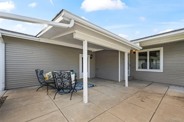 a view of house with outdoor seating space
