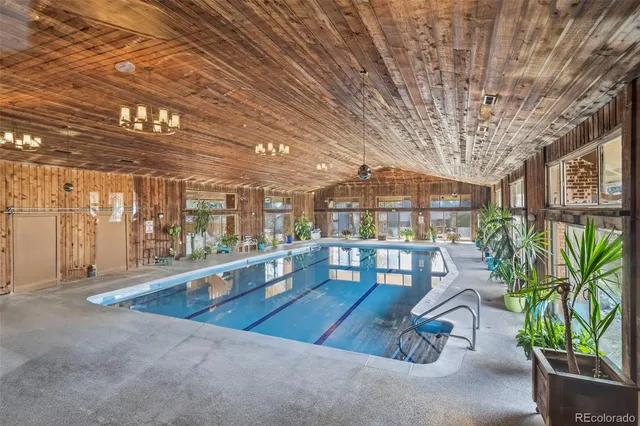 a lobby with furniture and a potted plant