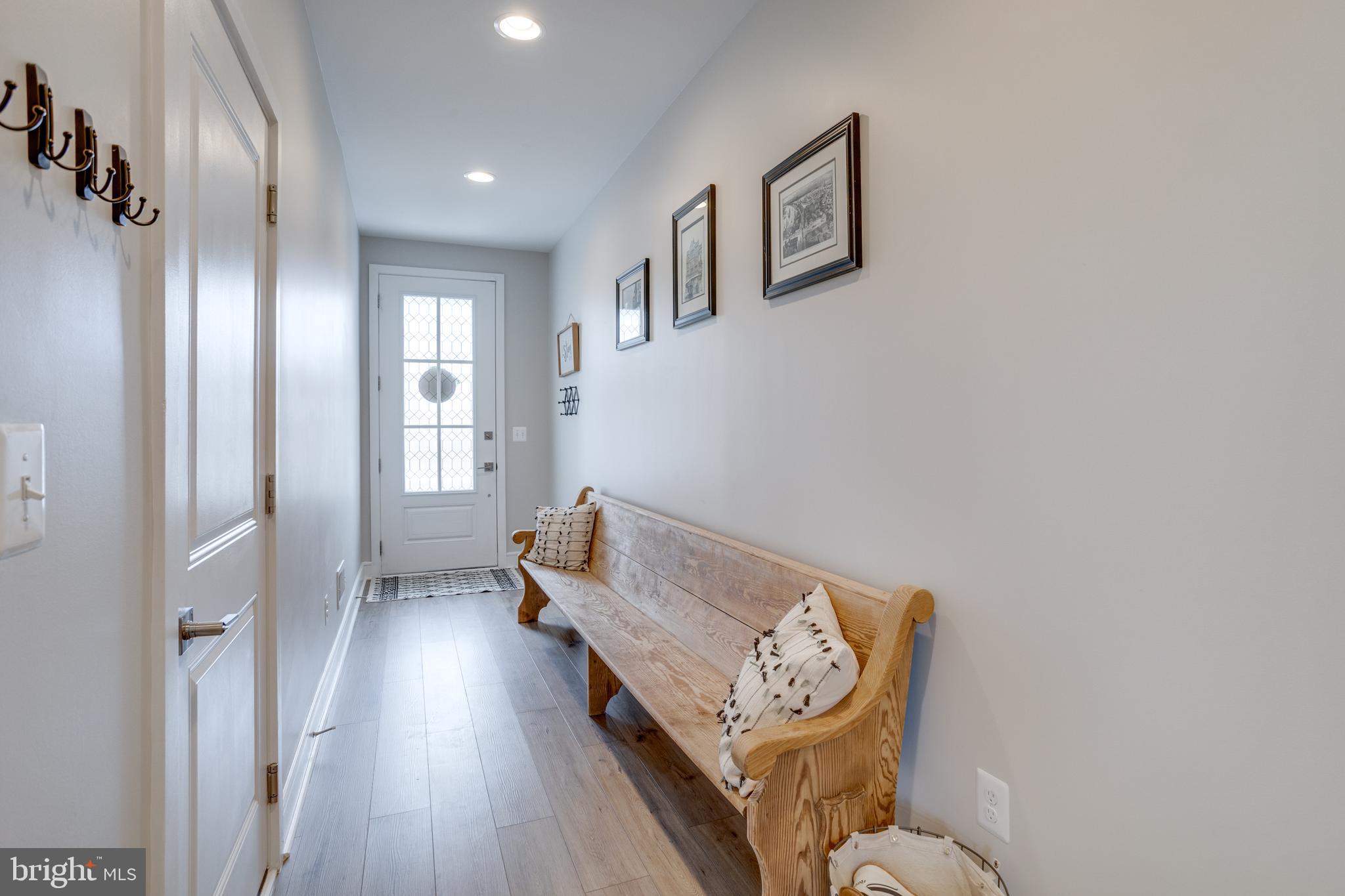 14488 Nebbiolo Drive Gainesville, VA 20155 - Photo 11 of 54 a living room with furniture and a wooden floor