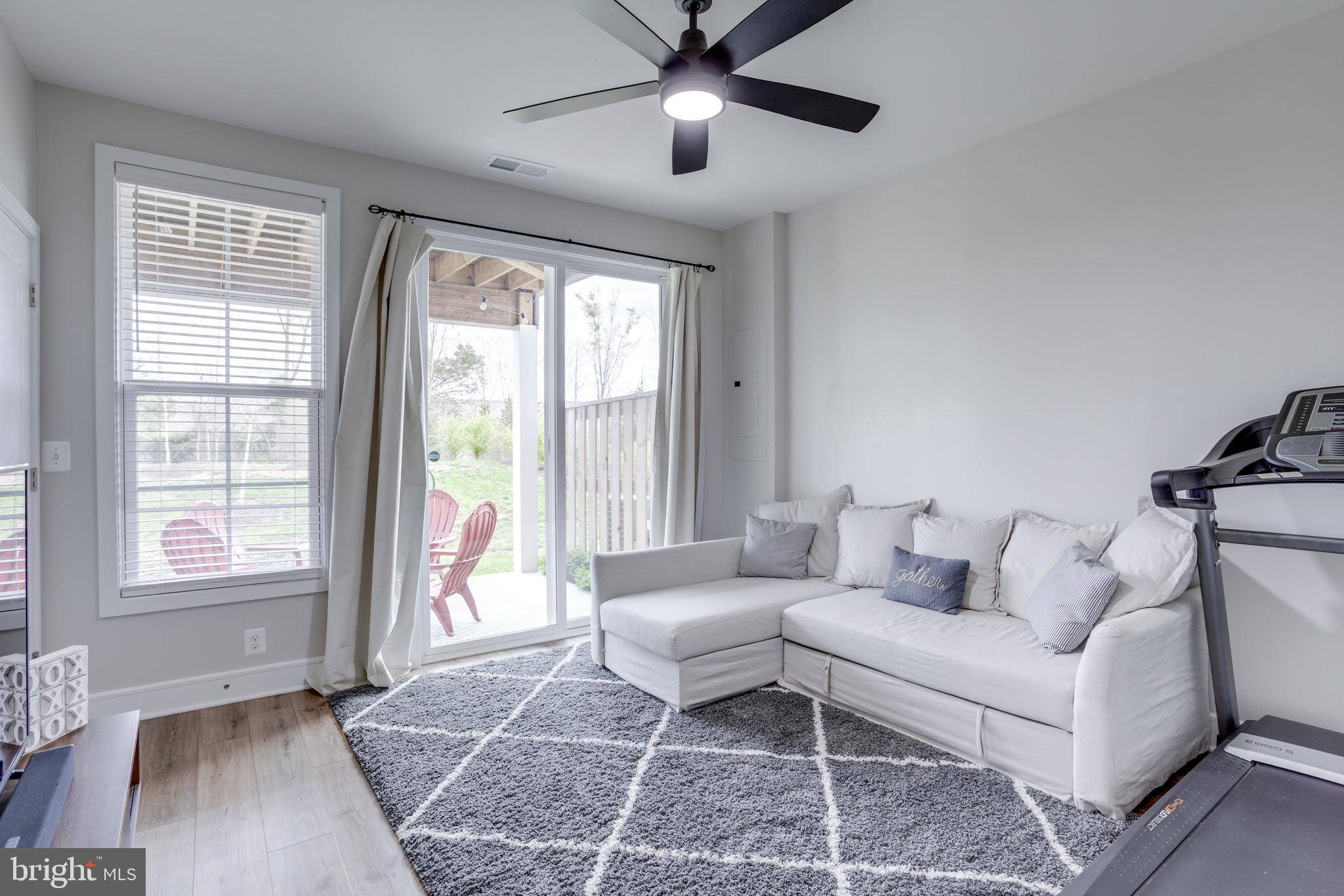 14488 Nebbiolo Drive Gainesville, VA 20155 - Photo 12 of 54 a living room with furniture and a window