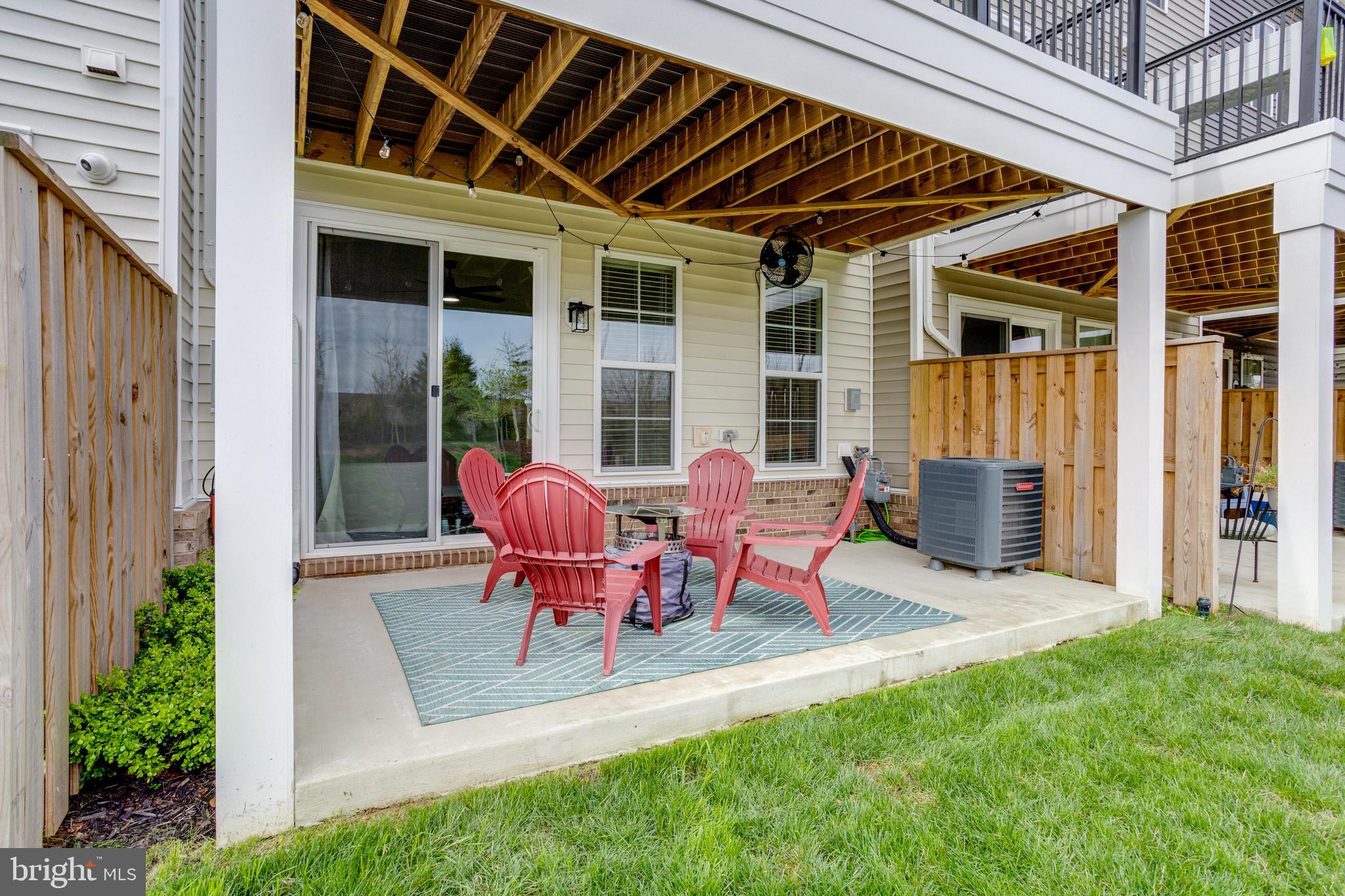 14488 Nebbiolo Drive Gainesville, VA 20155 - Photo 14 of 54 a view of a house with a backyard and sitting area