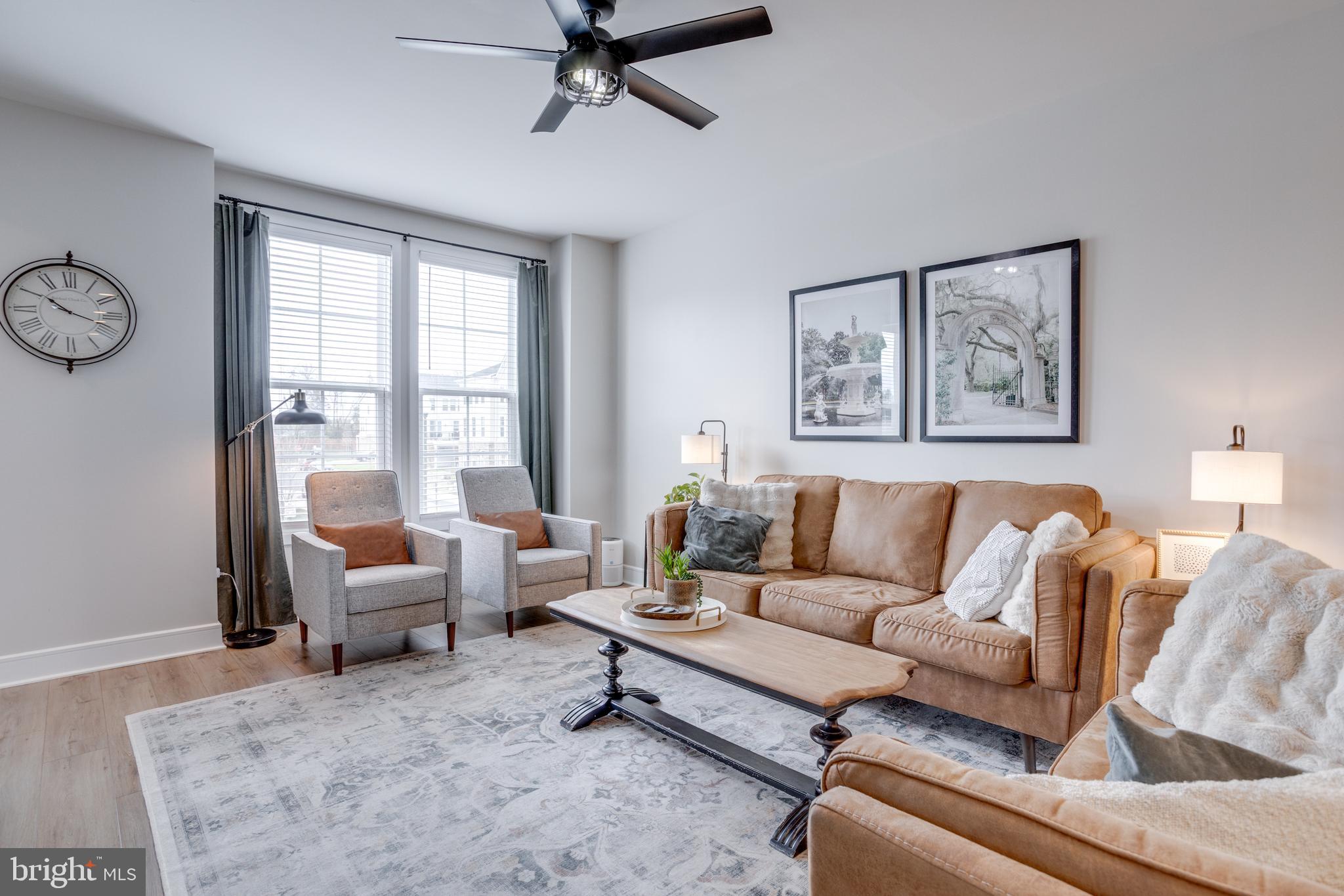 14488 Nebbiolo Drive Gainesville, VA 20155 - Photo 17 of 54 a living room with furniture and a large window