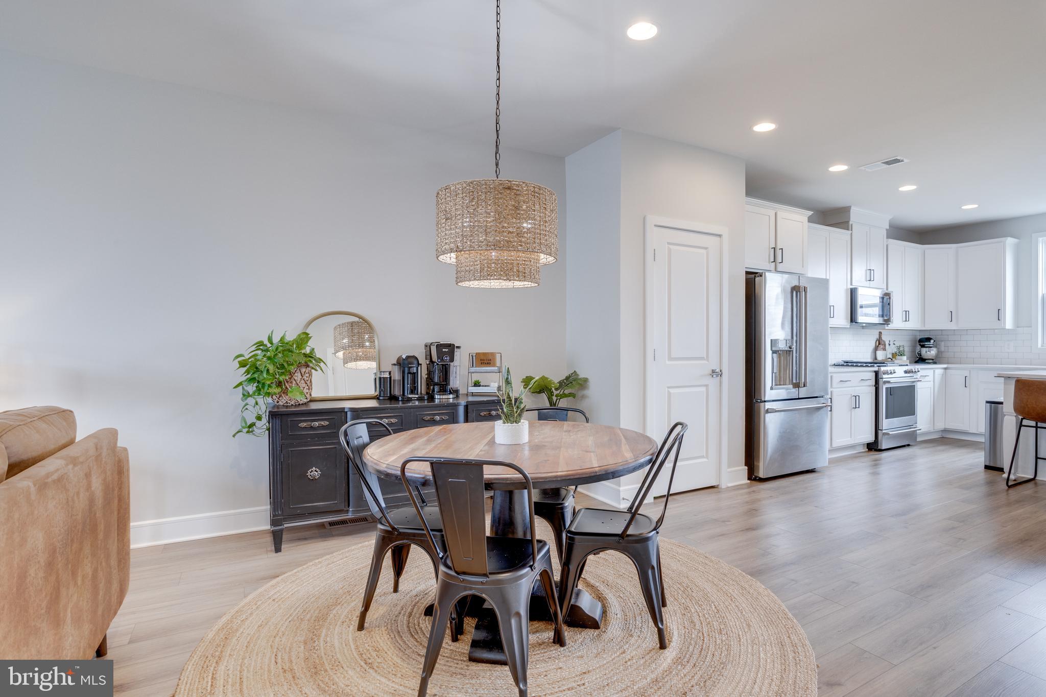 14488 Nebbiolo Drive Gainesville, VA 20155 - Photo 22 of 54 a dining room with furniture and window