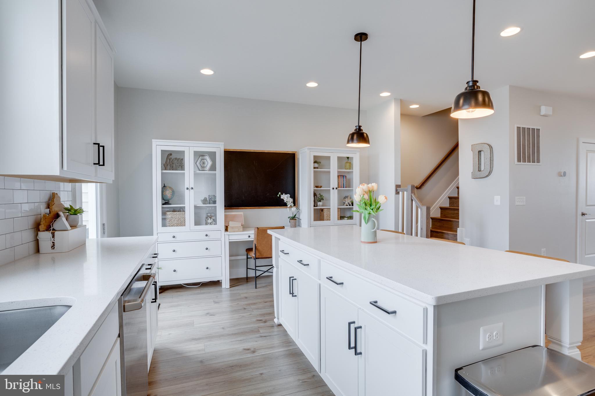 14488 Nebbiolo Drive Gainesville, VA 20155 - Photo 27 of 54 a living room with furniture and a flat screen tv