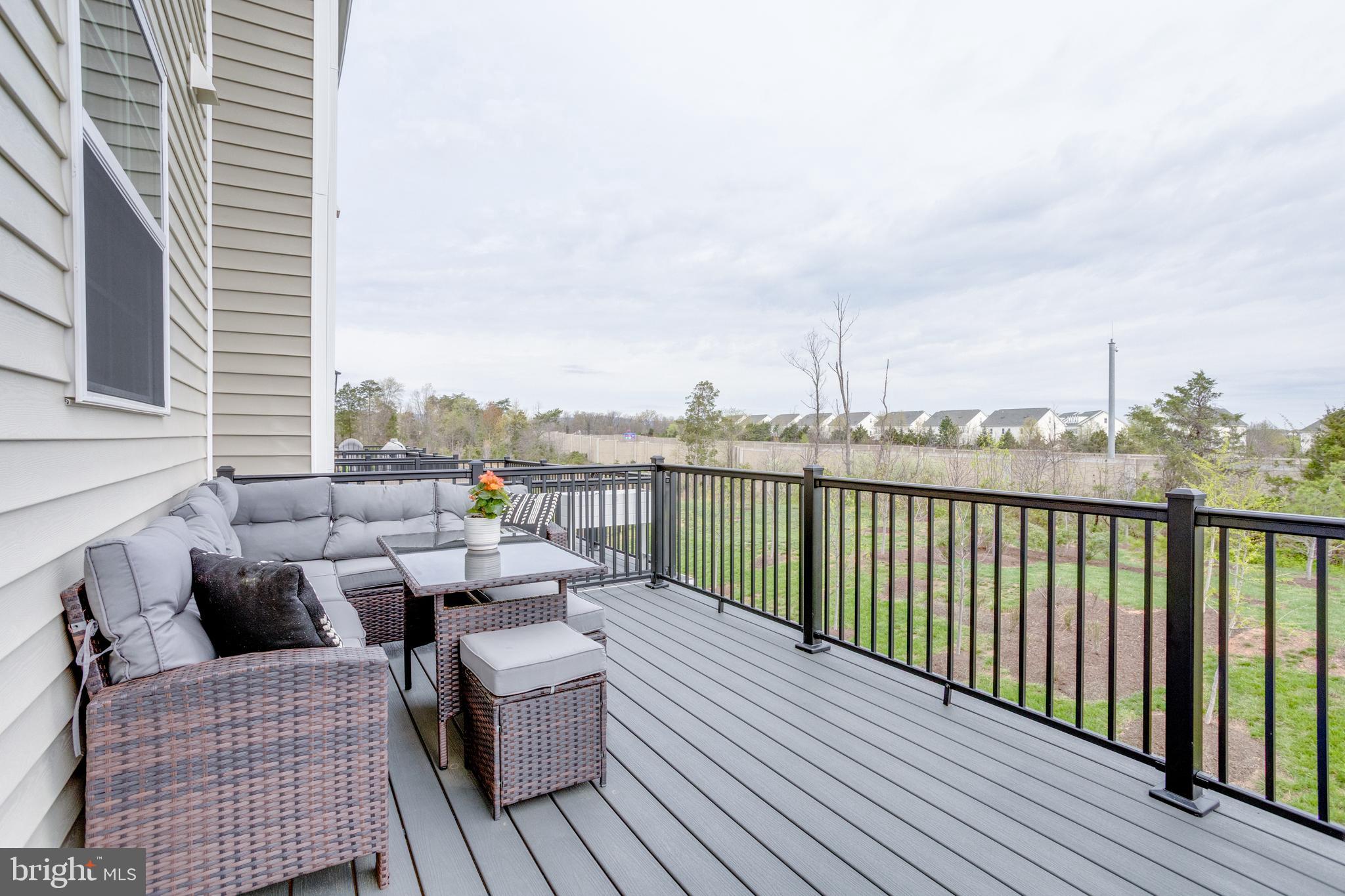 14488 Nebbiolo Drive Gainesville, VA 20155 - Photo 30 of 54 a balcony with wooden floor