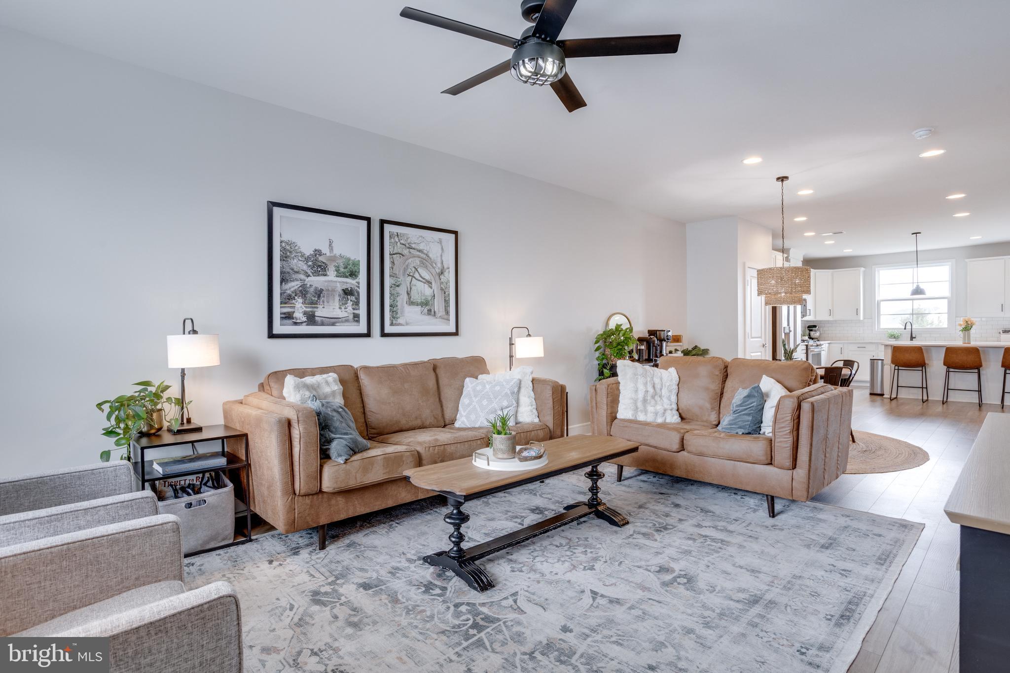14488 Nebbiolo Drive Gainesville, VA 20155 - Photo 3 of 54 a living room with furniture and a view of kitchen