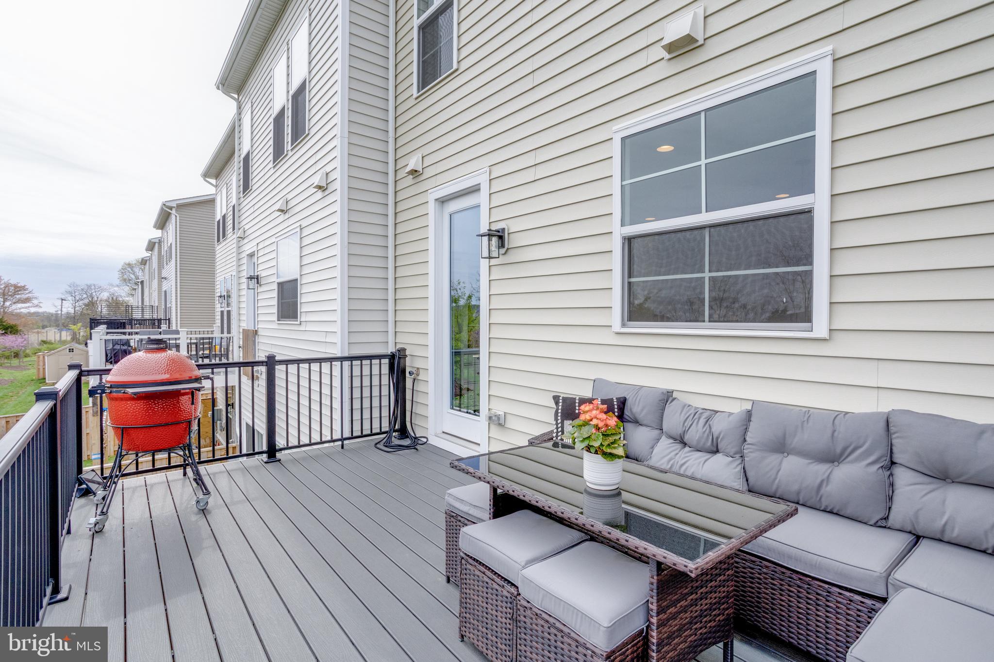 14488 Nebbiolo Drive Gainesville, VA 20155 - Photo 31 of 54 a building outdoor space with patio furniture