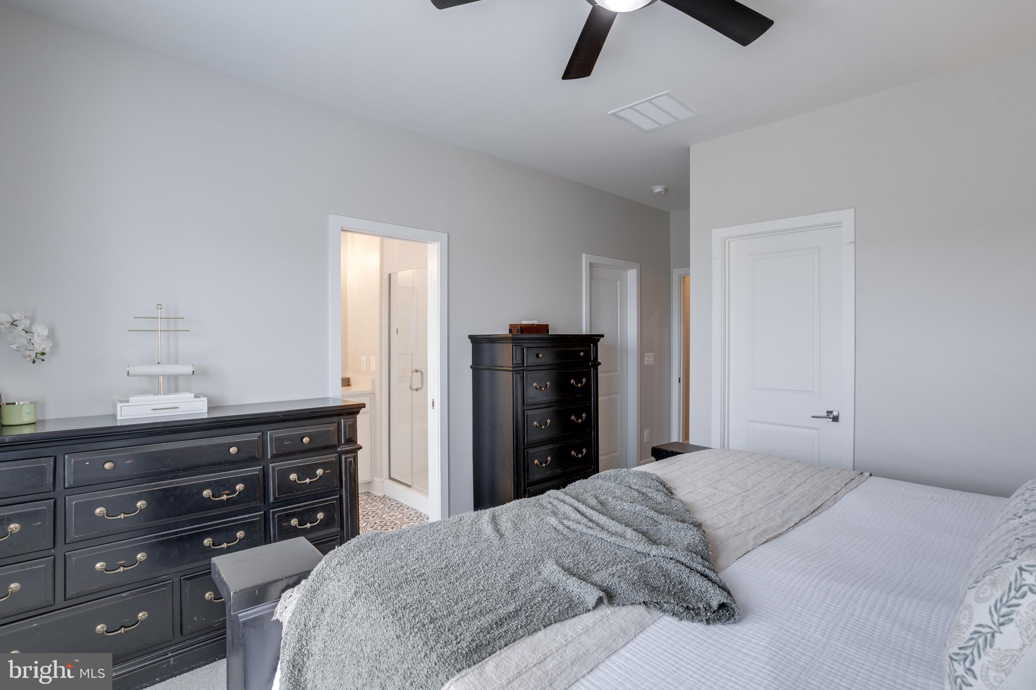 14488 Nebbiolo Drive Gainesville, VA 20155 - Photo 35 of 54 a bedroom with a bed and a dresser