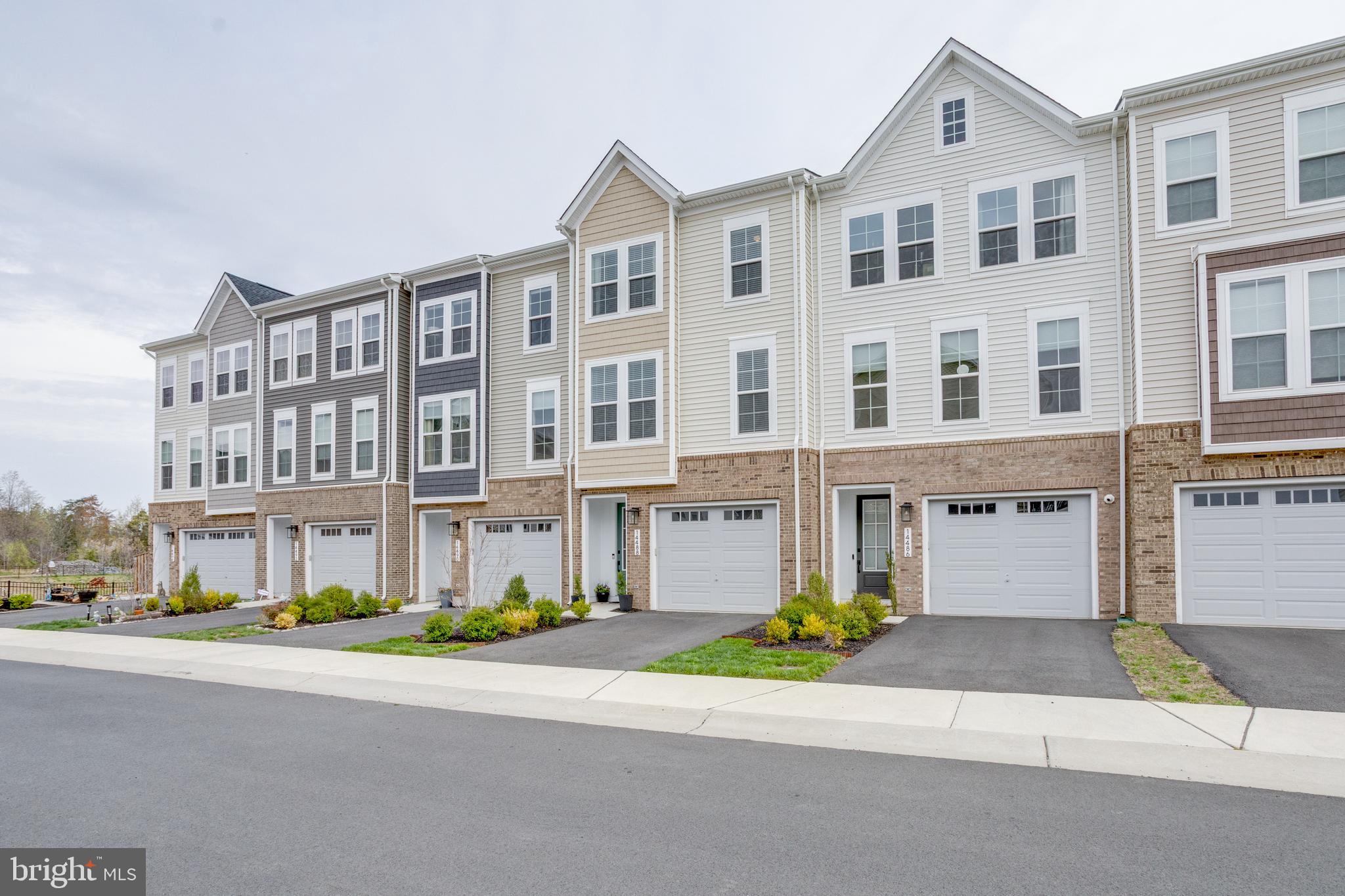 14488 Nebbiolo Drive Gainesville, VA 20155 - Photo 43 of 54 a front view of a building with street