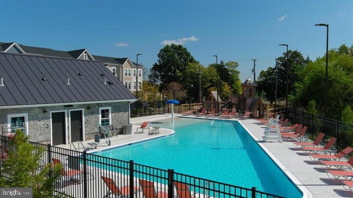 14488 Nebbiolo Drive Gainesville, VA 20155 - Photo 45 of 54 a view of a house with swimming pool and sitting area