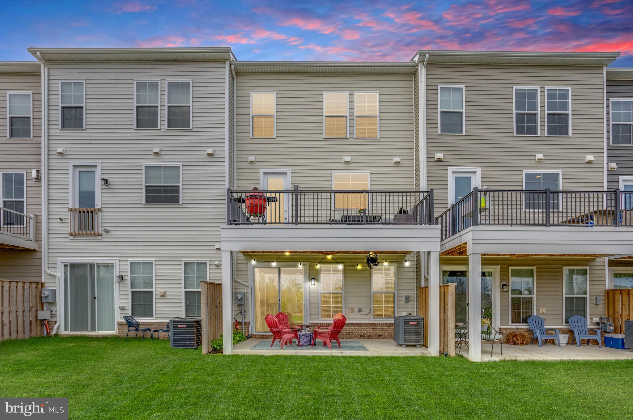 14488 Nebbiolo Drive Gainesville, VA 20155 - Photo 7 of 54 a group of people sitting in front of a building