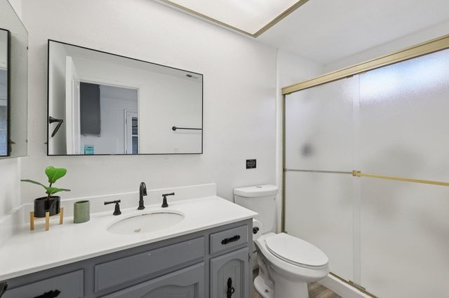 a en suite bathroom with a sink and a mirror