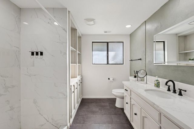 a view of swimming pool with a lounge chair