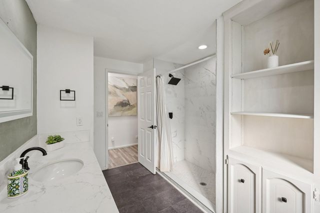 a view of a house with swimming pool and sitting area