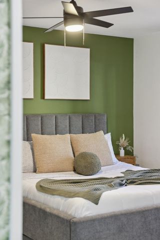 a view of a terrace with couches and sky view