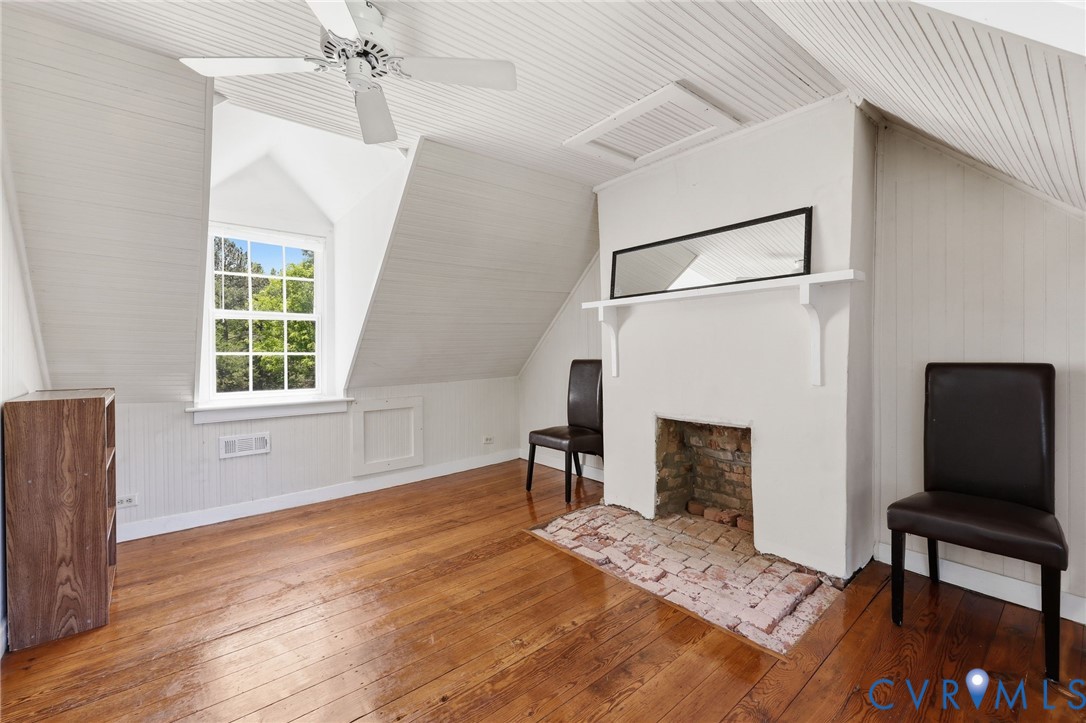 3355 Duke Road Powhatan, VA 23139 - Photo 27 of 67 a living room with furniture and a fireplace