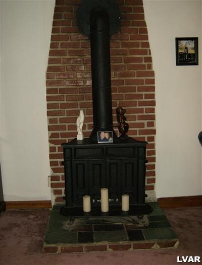 432 Ridge Avenue Allentown, PA 18102 - Photo 7 of 17 WOOD BURNING STOVE IN LIVING ROOM