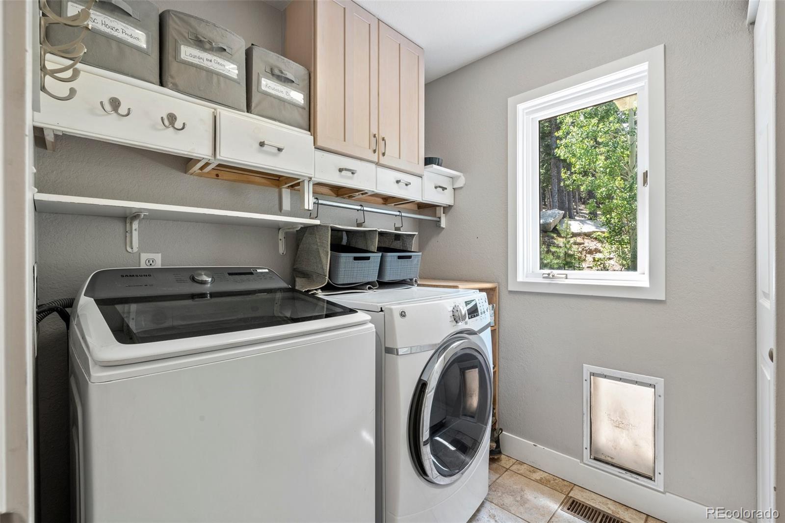 1682 Sinton Road Evergreen, CO 80439 - Photo 12 of 40 a utility room with dryer and washer