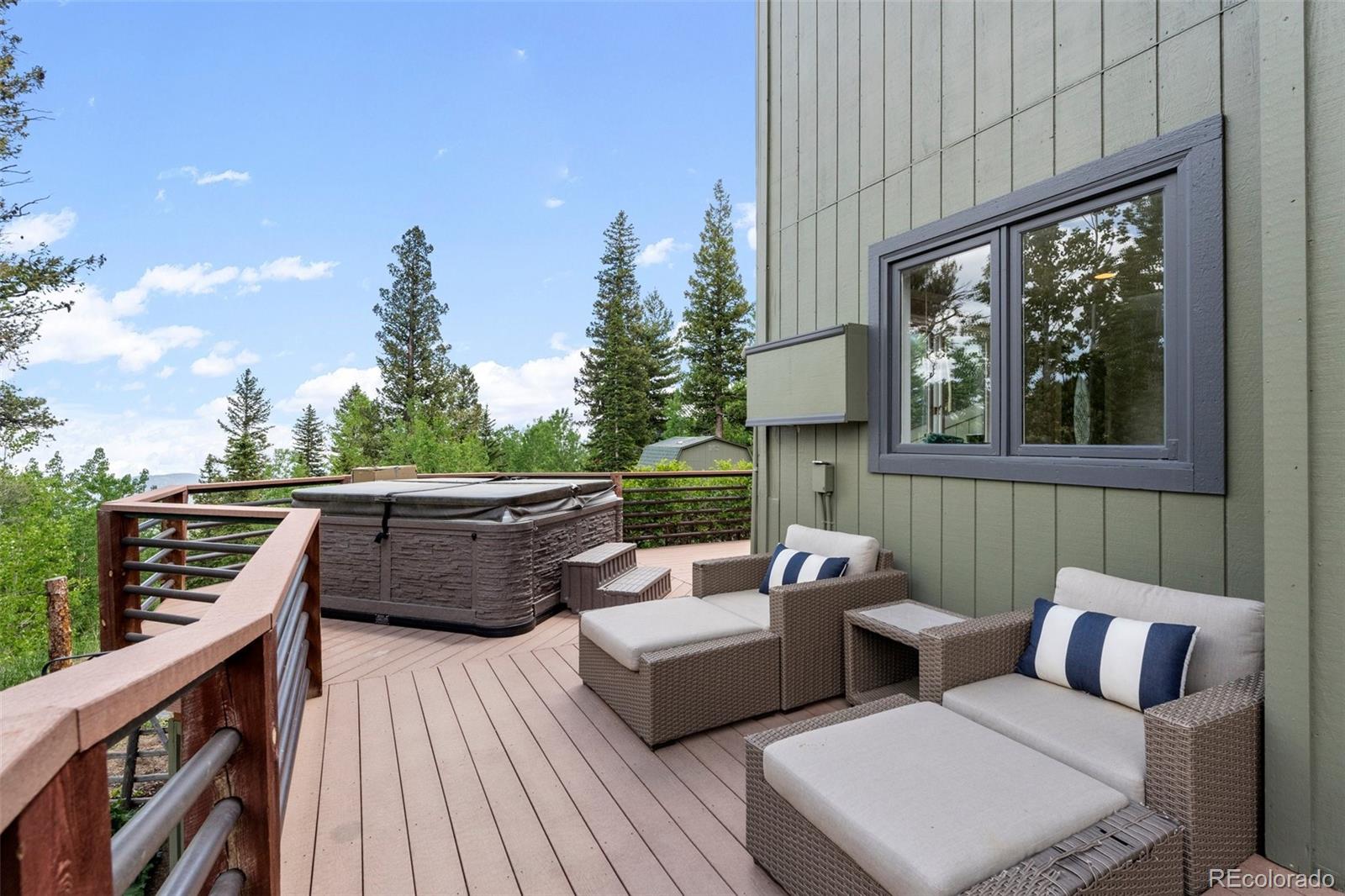 1682 Sinton Road Evergreen, CO 80439 - Photo 14 of 40 a view of a patio on the roof deck