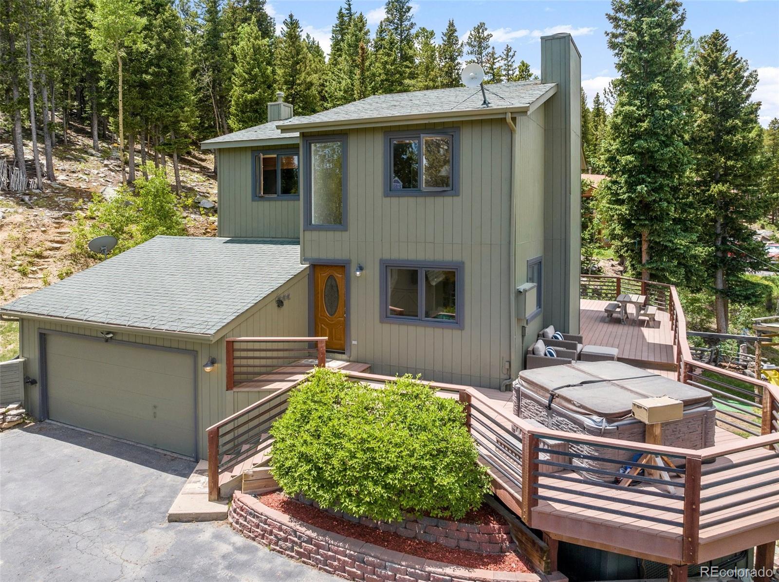 1682 Sinton Road Evergreen, CO 80439 - Photo 18 of 40 a aerial view of a house with yard and seating area