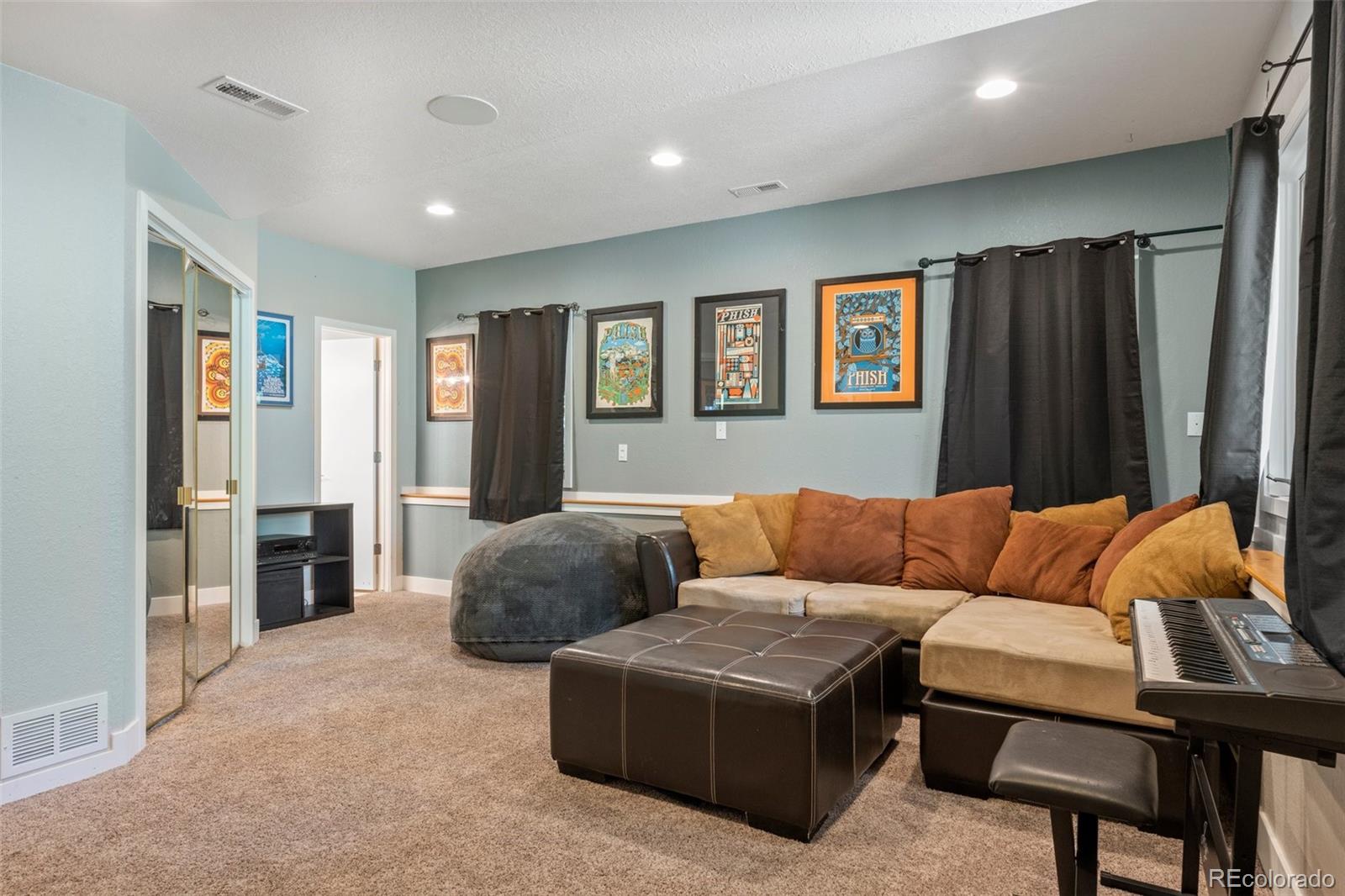 1682 Sinton Road Evergreen, CO 80439 - Photo 26 of 40 a living room with furniture and a window