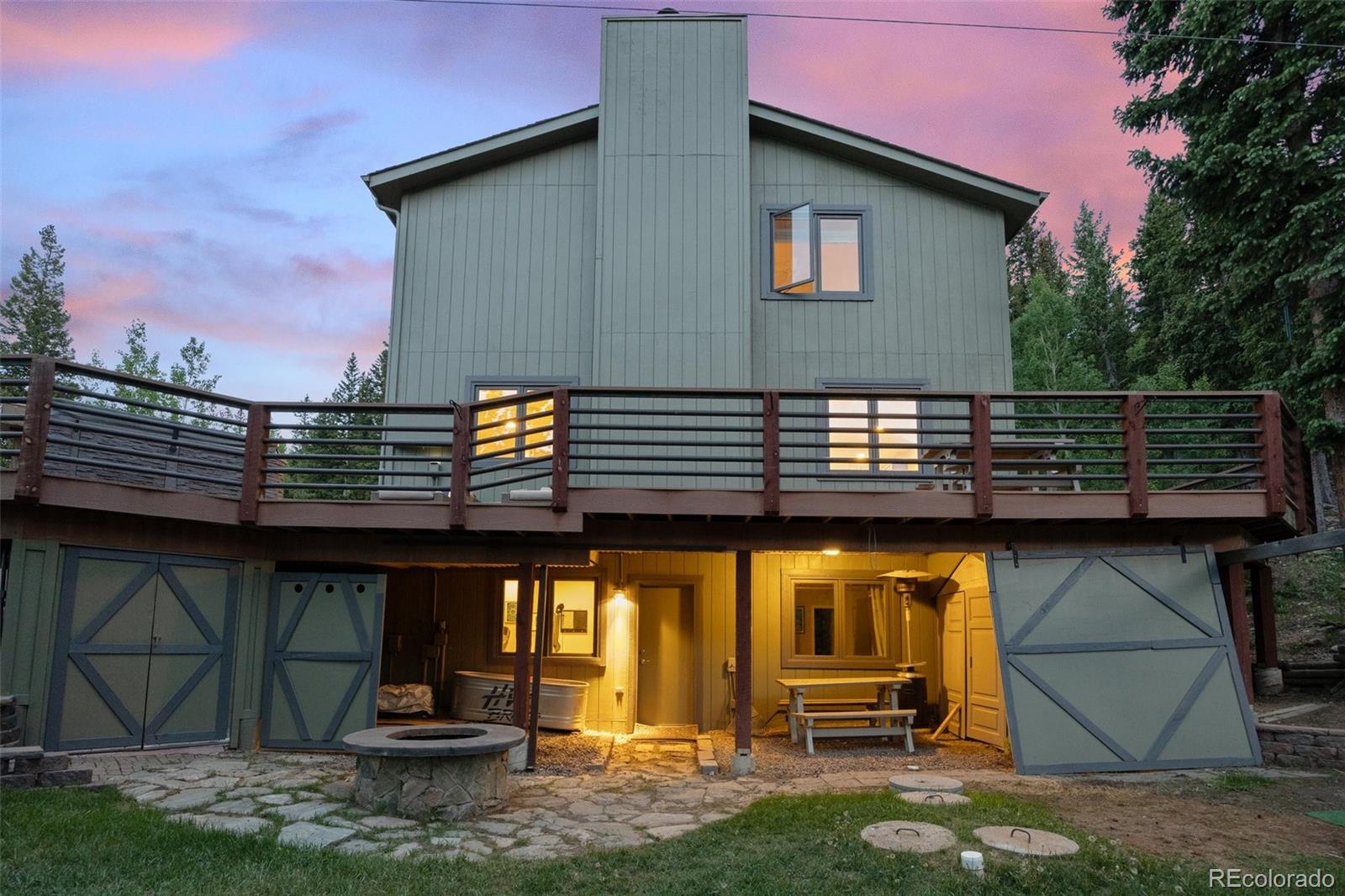 1682 Sinton Road Evergreen, CO 80439 - Photo 31 of 40 a front view of a house with garden