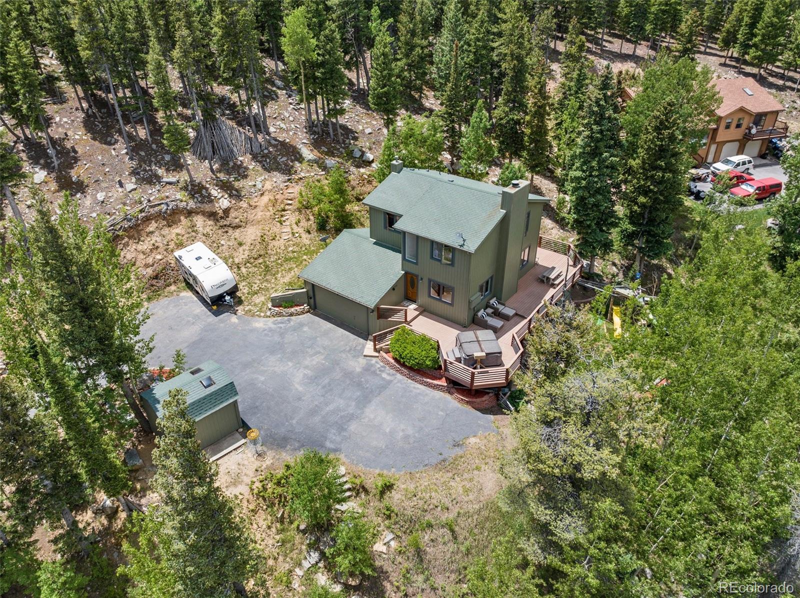 1682 Sinton Road Evergreen, CO 80439 - Photo 38 of 40 an aerial view of a house with yard swimming pool and outdoor seating