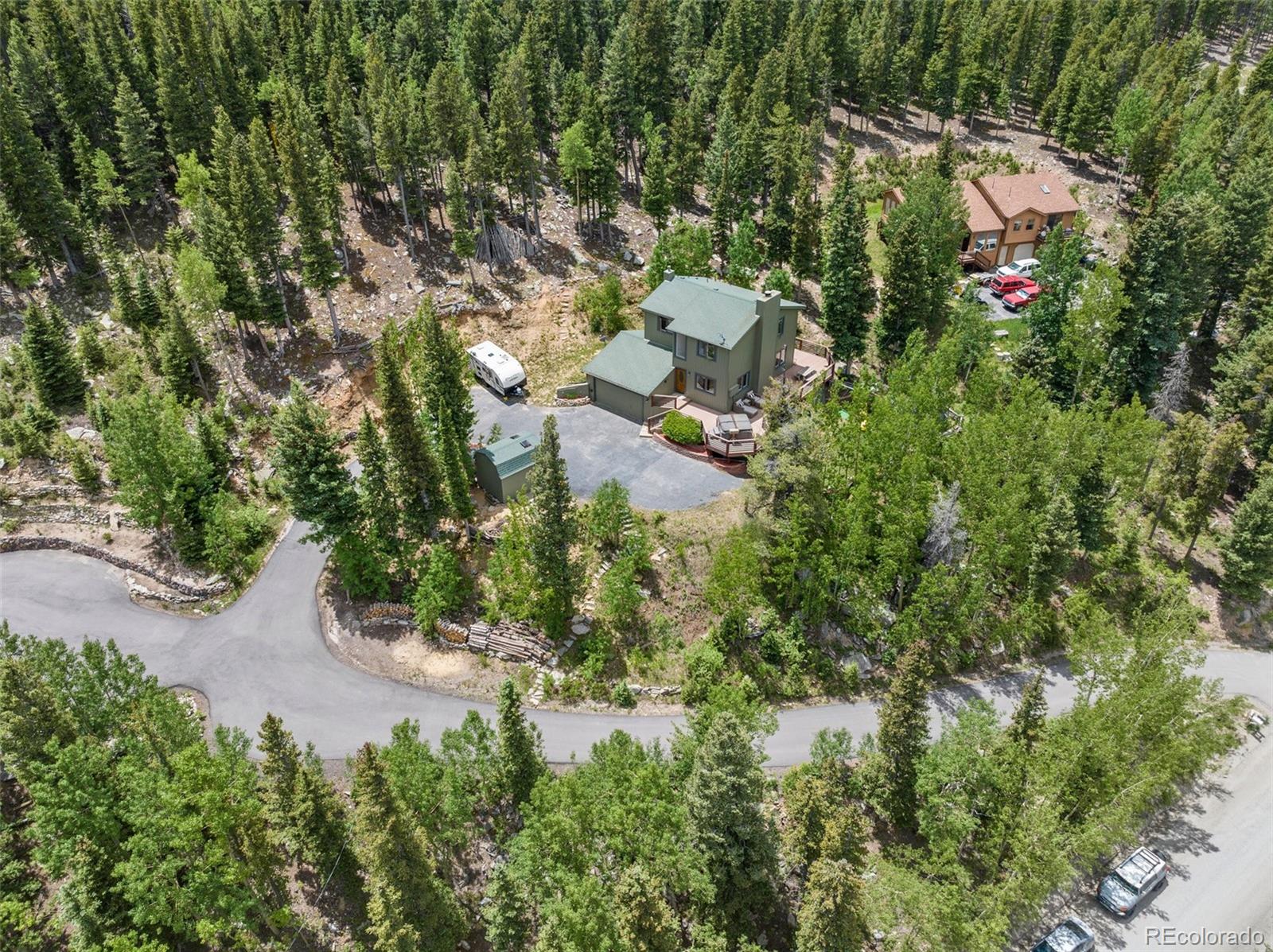 1682 Sinton Road Evergreen, CO 80439 - Photo 39 of 40 an aerial view of residential house with outdoor space and trees all around