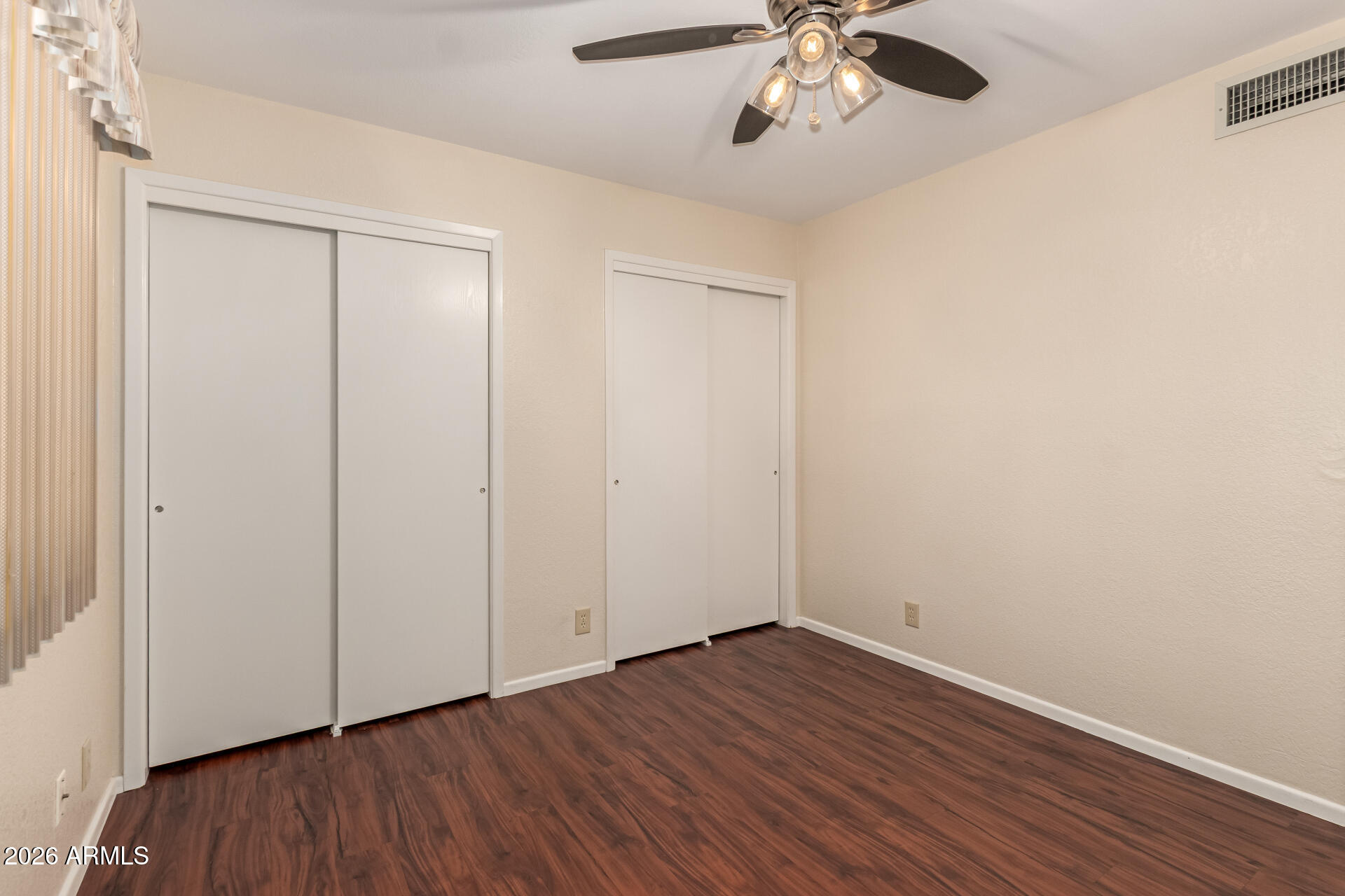 520 South Greenfield Road, Unit 30 Mesa, AZ 85206 - Photo 21 of 29 a view of an empty room with wooden floor