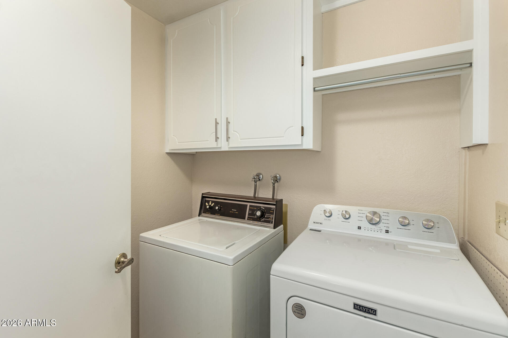 520 South Greenfield Road, Unit 30 Mesa, AZ 85206 - Photo 25 of 29 a view of washer and dryer with bathroom in the background