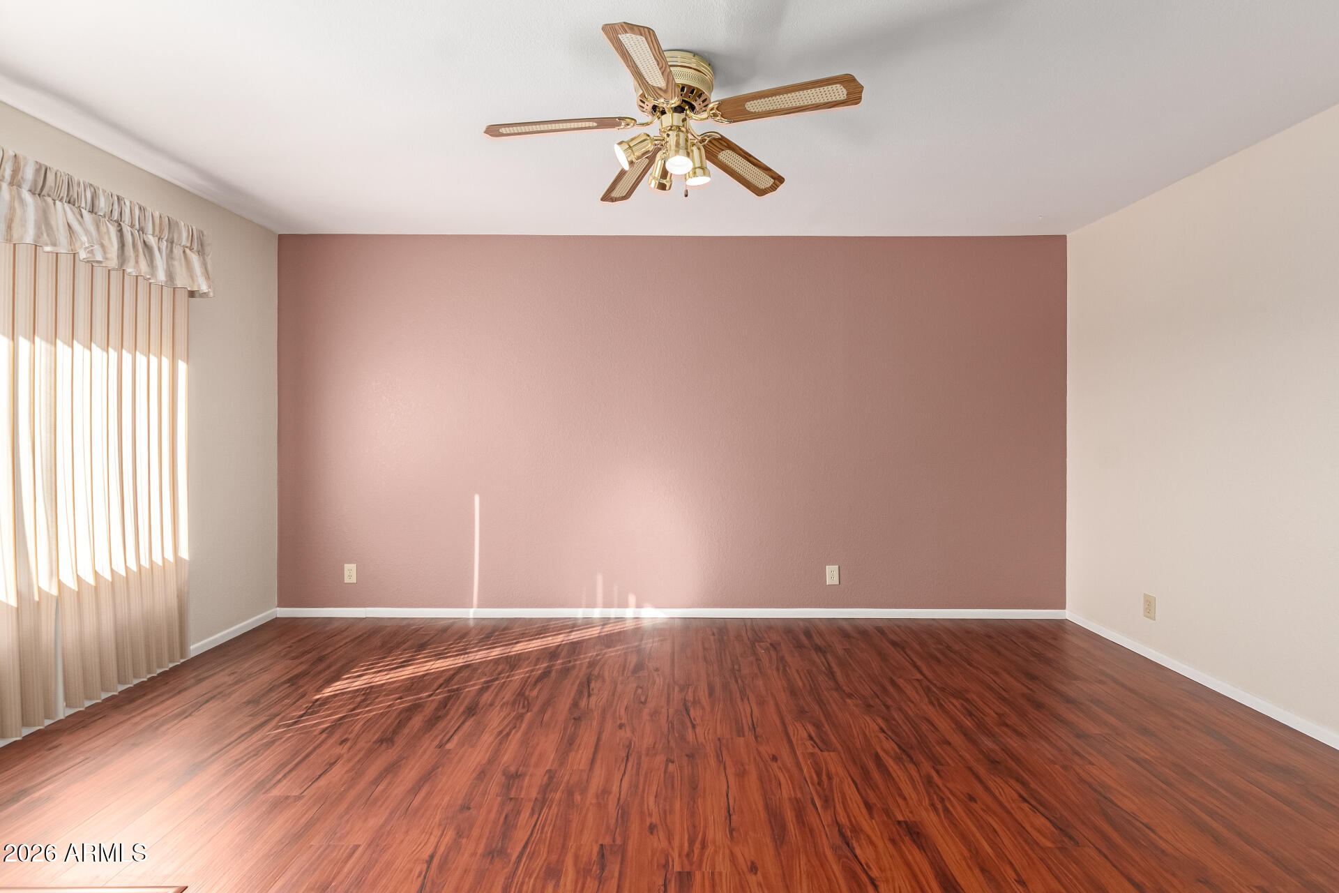 520 South Greenfield Road, Unit 30 Mesa, AZ 85206 - Photo 7 of 29 wooden floor in an empty room with a window