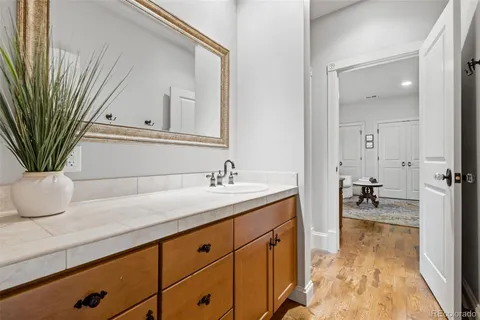 a bathroom with a sink a vanity and a mirror