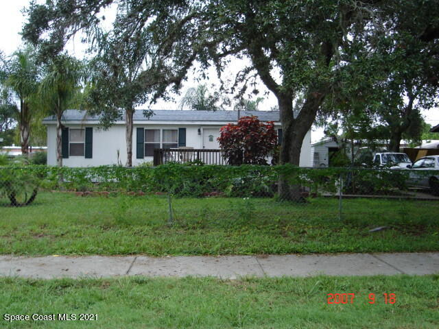 3128 Brockett Road Mims, FL 32754 - Photo 1 of 1 a front view of a house with a yard