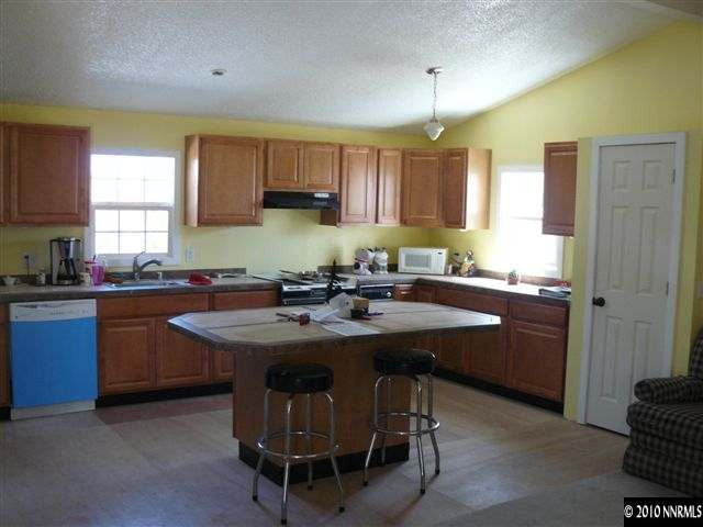 2695 Daffodil Way Reno, NV 89512 - Photo 2 of 5 a kitchen with a sink stove and cabinets
