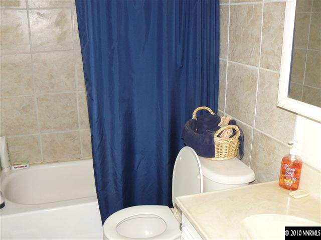 2695 Daffodil Way Reno, NV 89512 - Photo 3 of 5 a bathroom with a toilet and sink