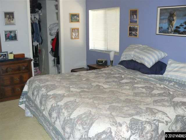 2695 Daffodil Way Reno, NV 89512 - Photo 4 of 5 a bedroom with a bed and a dresser