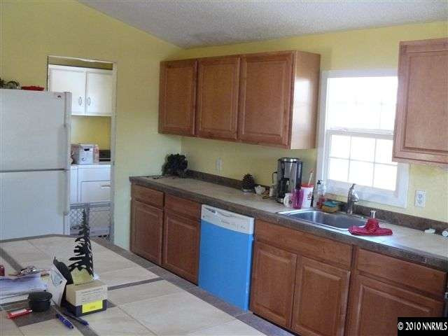 2695 Daffodil Way Reno, NV 89512 - Photo 5 of 5 a kitchen with a sink cabinets and window