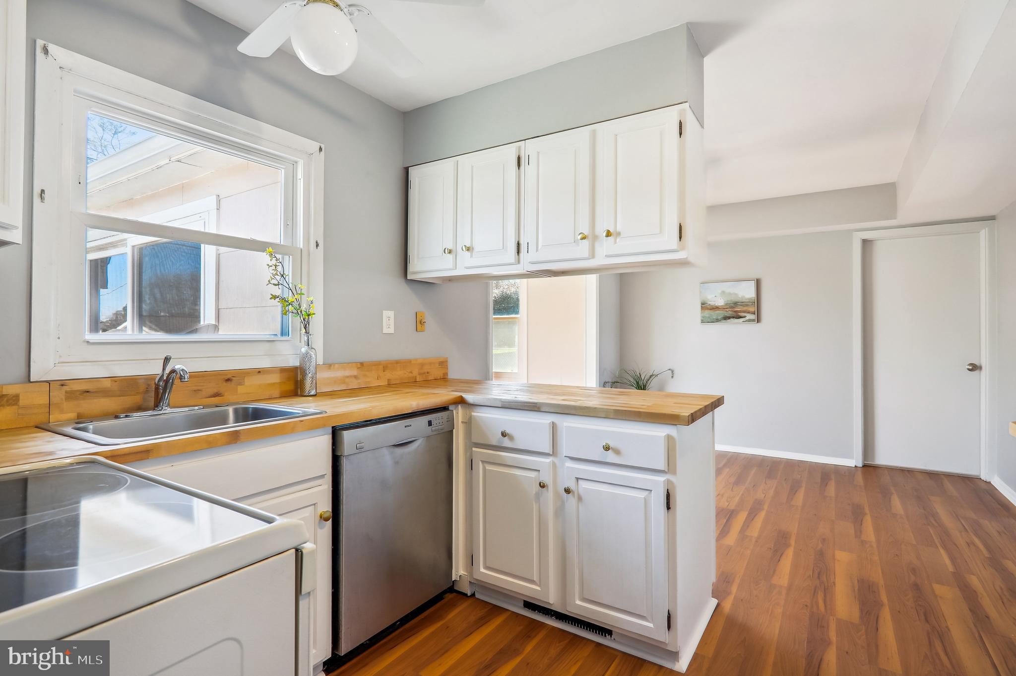 12403 Shawmont Lane Bowie, MD 20715 - Photo 11 of 59 a kitchen with cabinets a sink and appliances