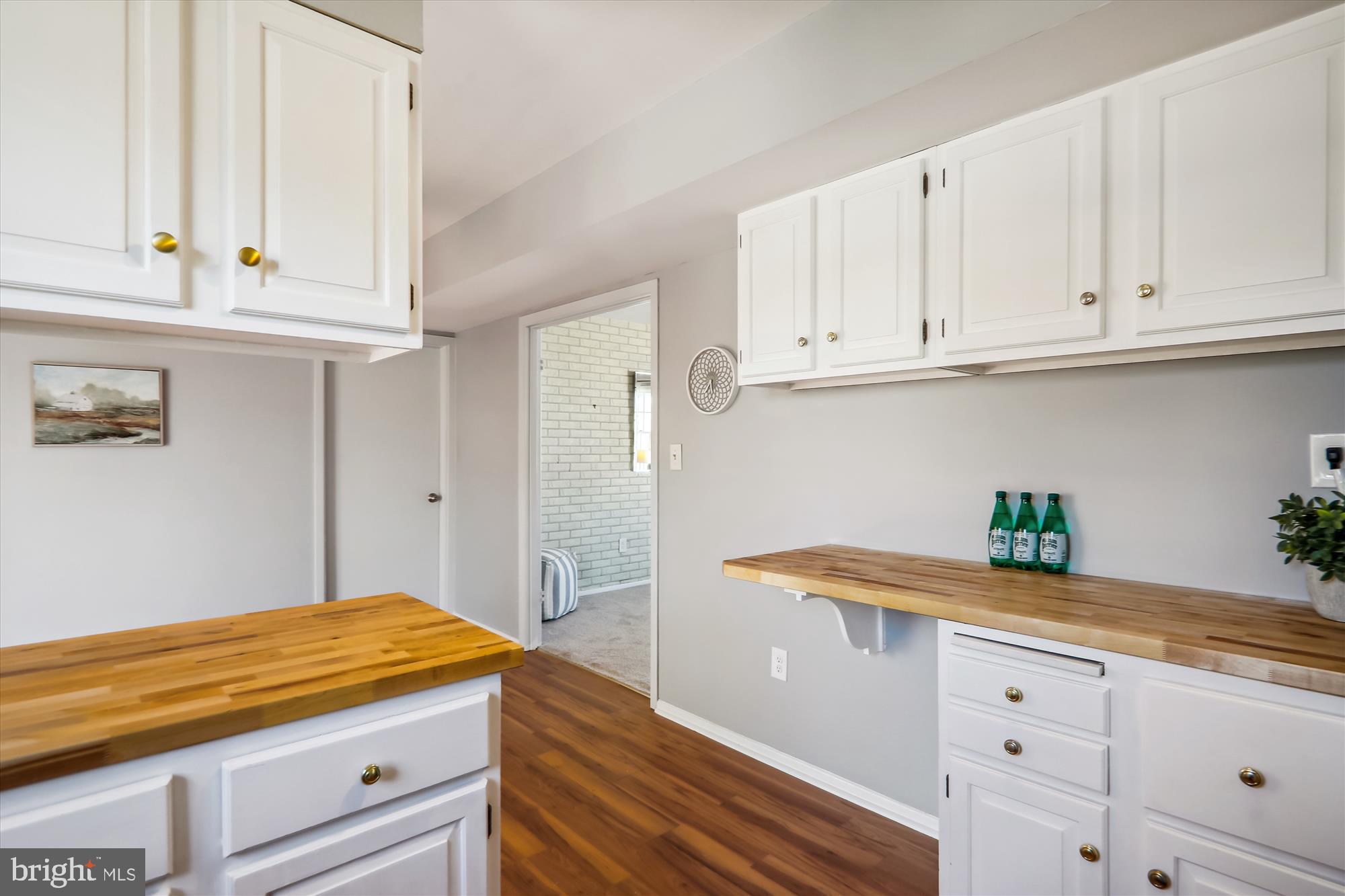 12403 Shawmont Lane Bowie, MD 20715 - Photo 12 of 59 a kitchen with white cabinets and a sink