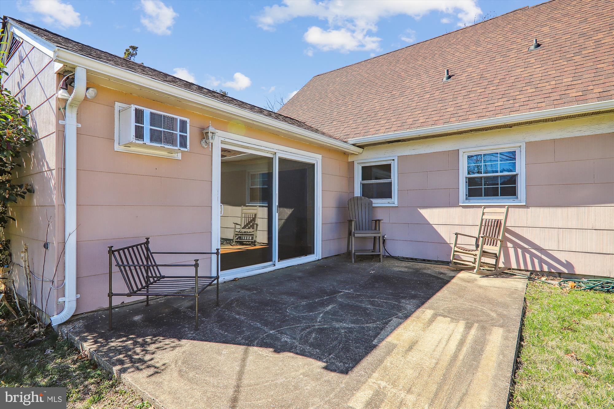 12403 Shawmont Lane Bowie, MD 20715 - Photo 17 of 59 a view of a patio with table and chairs and wooden floor