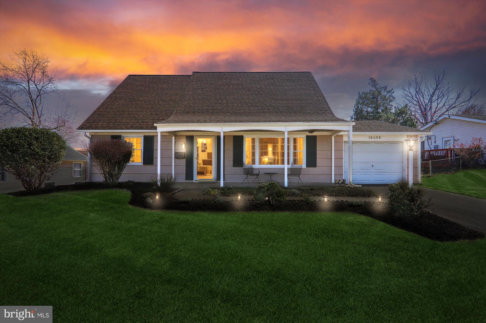 12403 Shawmont Lane Bowie, MD 20715 - Photo 2 of 59 a front view of a house with garden and patio