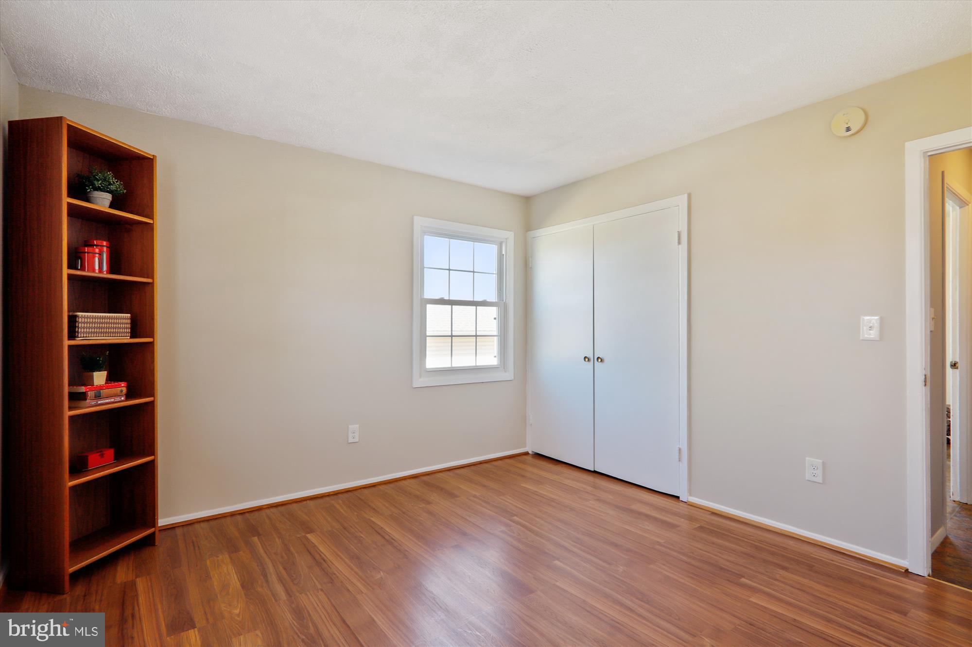 12403 Shawmont Lane Bowie, MD 20715 - Photo 22 of 59 a view of an empty room with closet and wooden floor