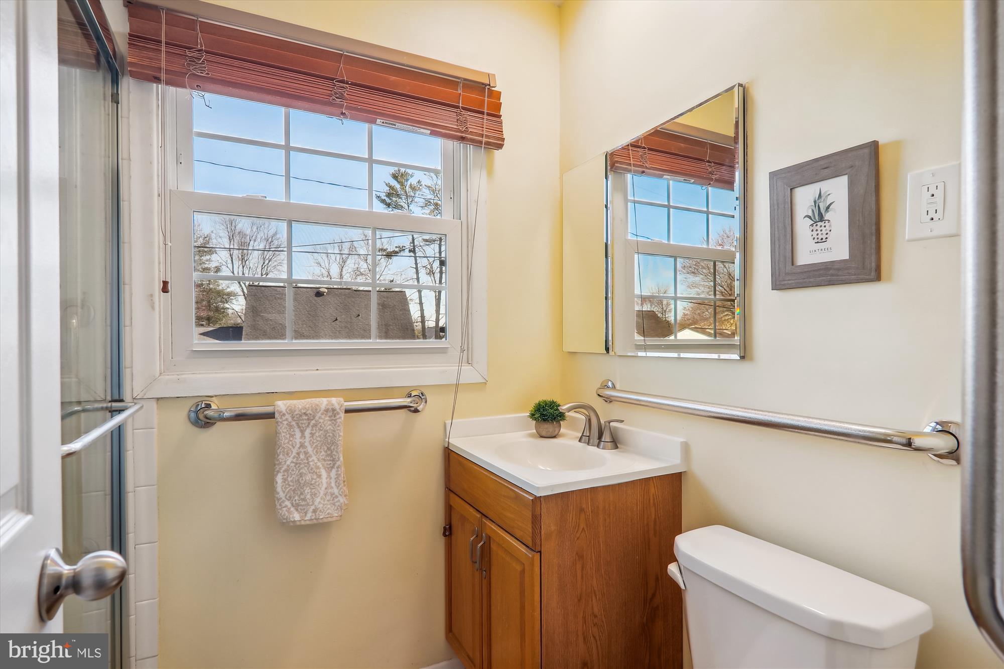 12403 Shawmont Lane Bowie, MD 20715 - Photo 26 of 59 a bathroom with a sink a toilet and shower