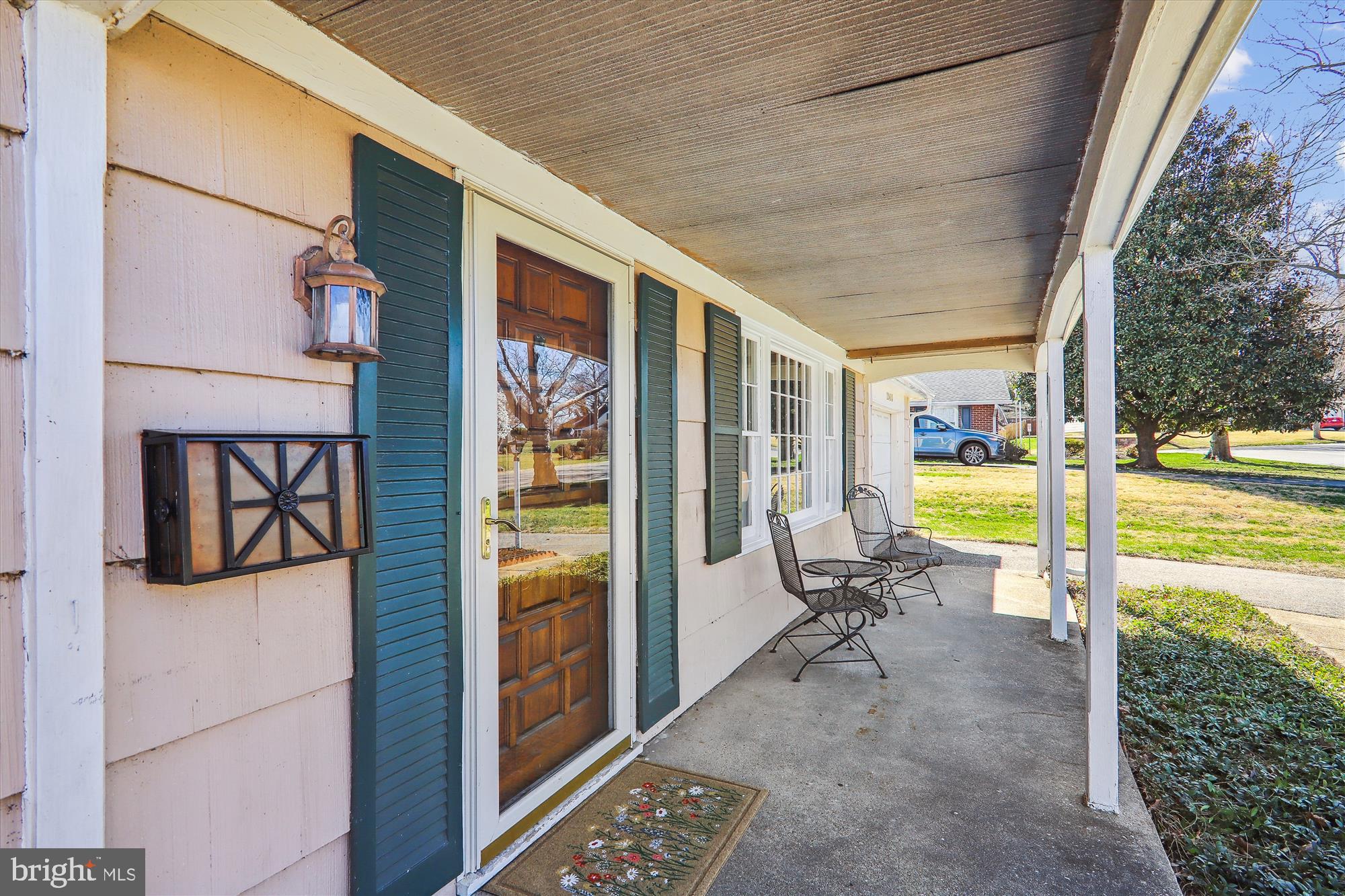 12403 Shawmont Lane Bowie, MD 20715 - Photo 3 of 59 a view of a porch with chairs and backyard